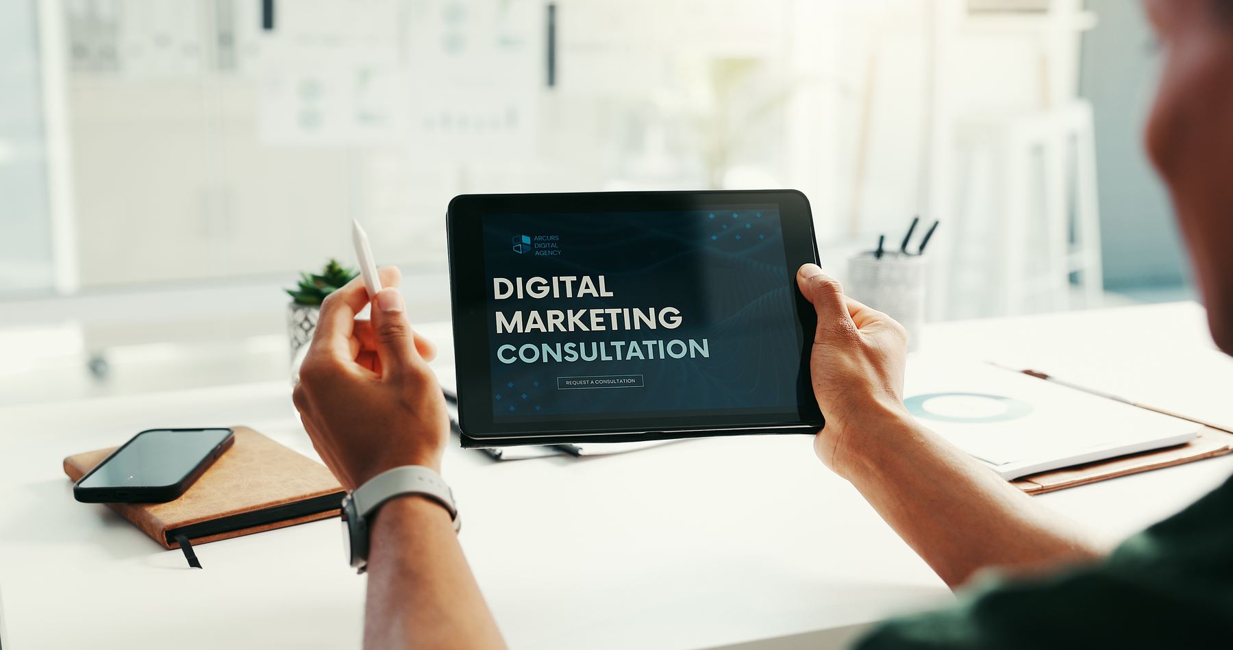 Business owner reviewing a digital marketing strategy on a tablet